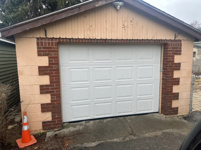 Brick and stucco one-car garage